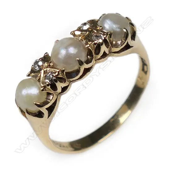 An estate 18ct gold pearl and diamond ring,