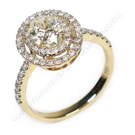 A 14ct gold yellow diamond double halo ring,