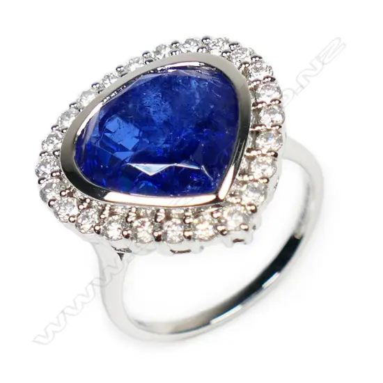 A 14ct white gold, tanzanite and diamond halo cocktail ring,
