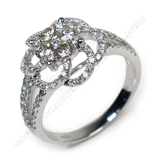 An 18ct white gold and diamond cluster ring,