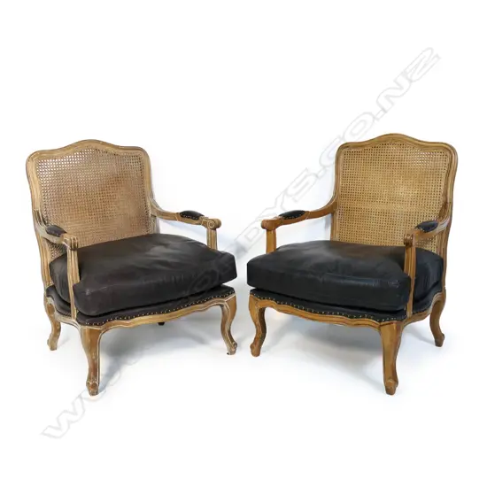 A pair of French fauteuil open elbow arm chairs,