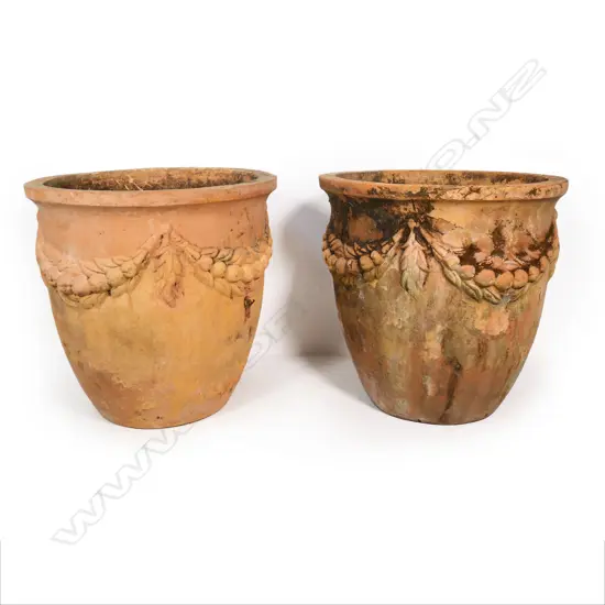 A pair of impressive terracotta garden pots,