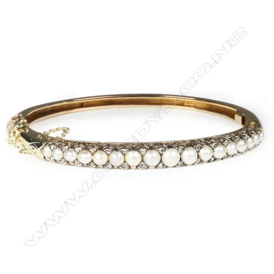 A quality c1900 15ct rose gold pearl and diamond snap bangle,