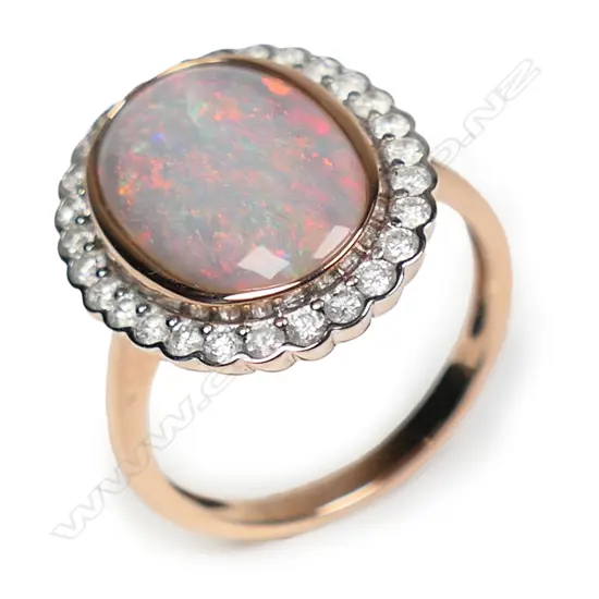 A 14ct rose gold opal and diamond halo ring,