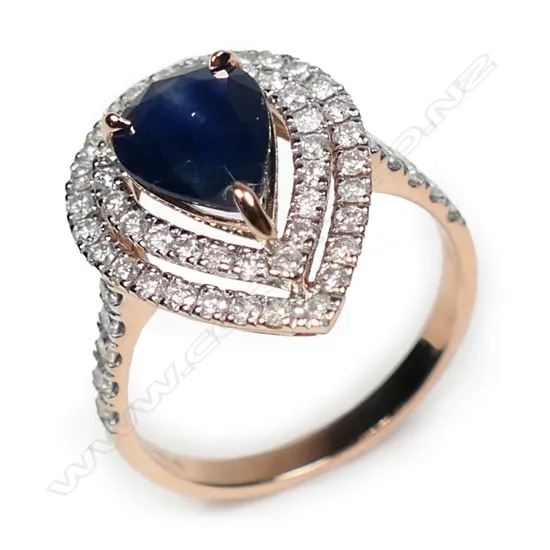 A 14ct rose gold sapphire and diamond double halo ring,