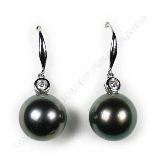 A pair of 14ct white gold diamond and pearl earrings,