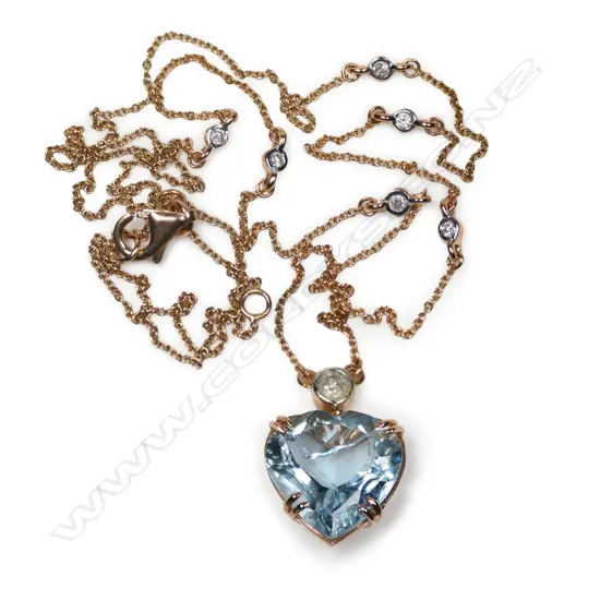 A 14ct rose gold aquamarine and diamond pendant necklace,