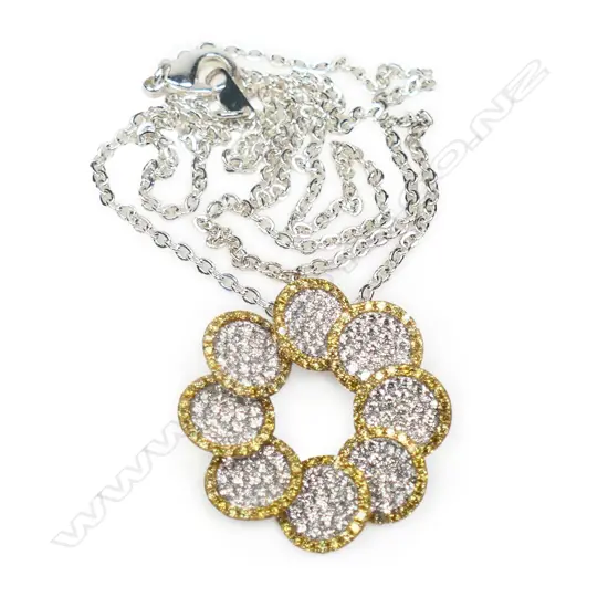 An 18ct white gold and multi diamond pendant,