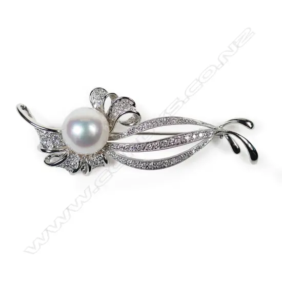 An 18ct white gold diamond and pearl brooch,