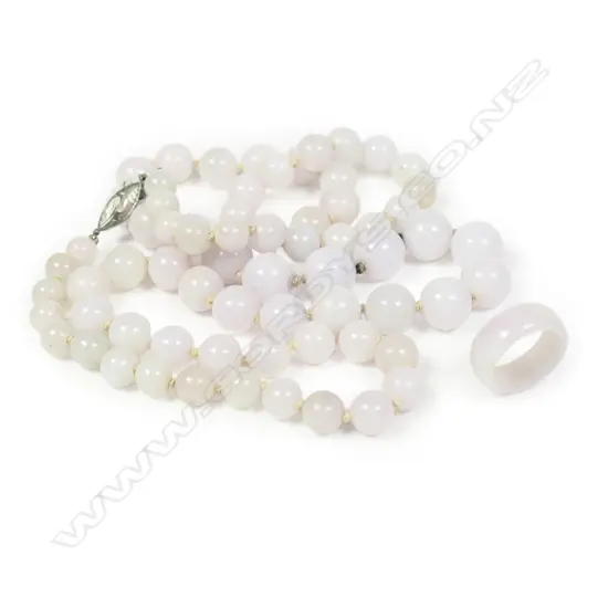 A pale jade long spherical bead necklace and matching ring,