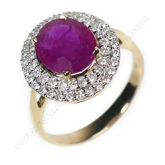 A 14ct gold ruby and diamond double halo ring,