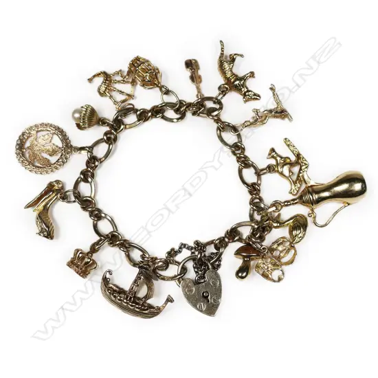 A vintage 9ct yellow gold multi charm bracelet,