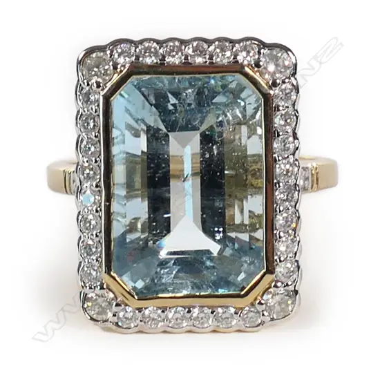 A 14ct gold aquamarine and diamond halo ring,