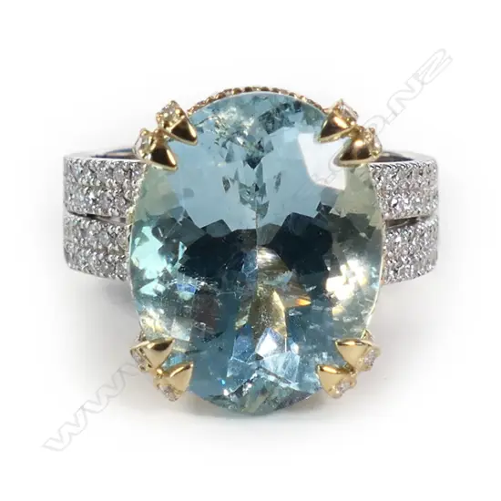 A 14ct white and yellow gold aquamarine and diamond dress ring,