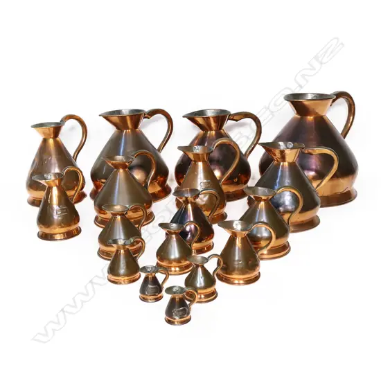 An unusually large set of seventeen Victorian copper harvest measures,