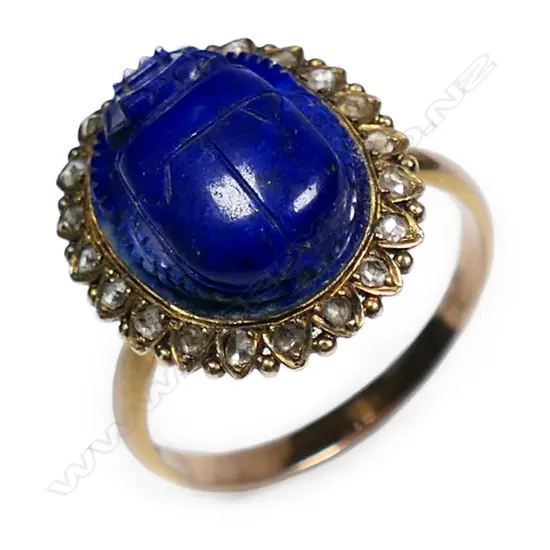 An early 20thC 9ct yellow gold lapis and diamond set ring,