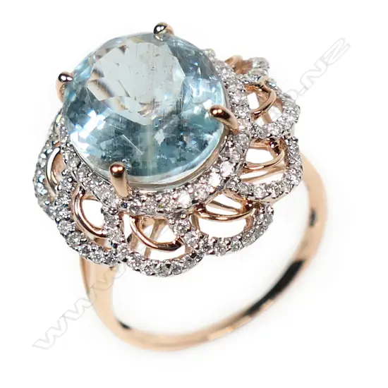 A 14ct rose gold aquamarine and diamond floral style ring,