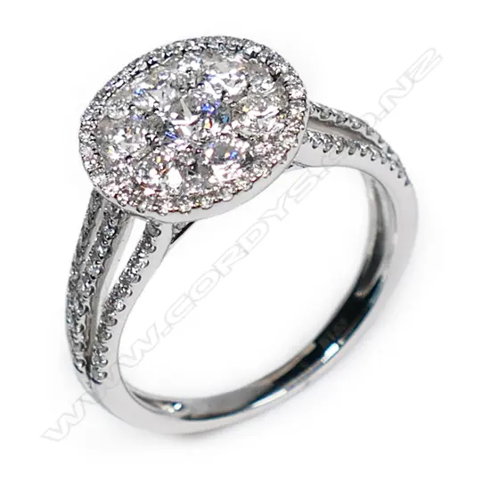 An 18ct white gold and diamond set cluster ring,