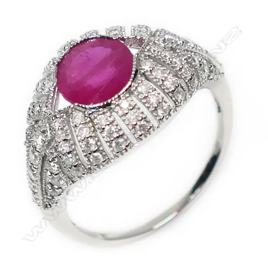 A 14ct white gold ruby and diamond cluster ring,