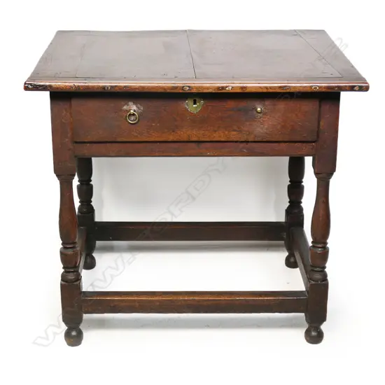 A Georgian oak lowboy,
