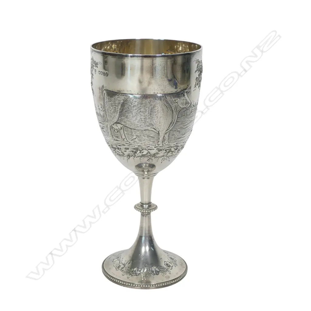 The New Zealand historic 'A.A. & P.A. 1881' silver trophy cup for Best Cow, presentation engraved, awarded to John Grey Esq. and presented by 'Messrs. Wilson & Horton'. Engraved and embossed with a cow. London 1879 by Richards & Brown (Edward Charles Brown). H.195mm. 208gms. Image 1++