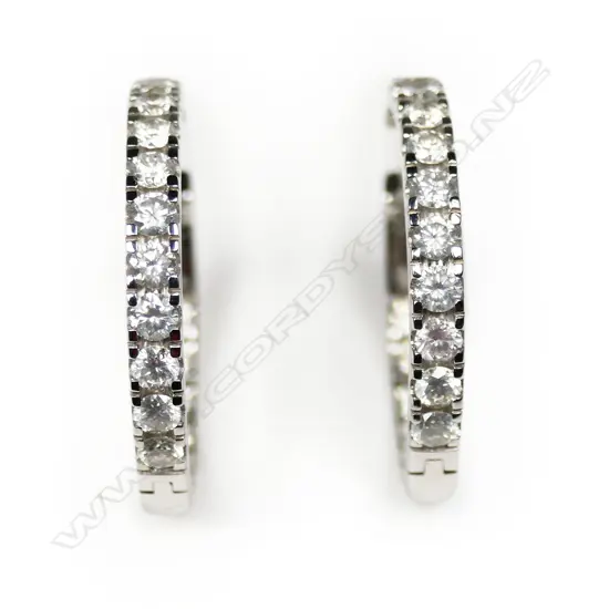 A pair of 14ct white gold and diamond hoop earrings,