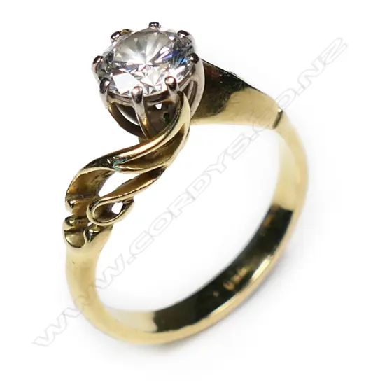 An 18ct gold and diamond solitaire ring,