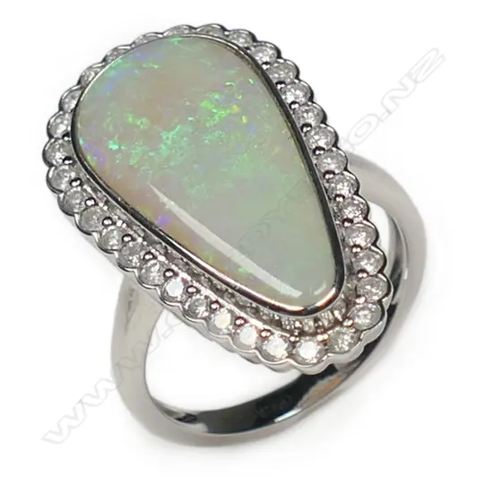 A 14ct white gold opal and diamond halo ring,