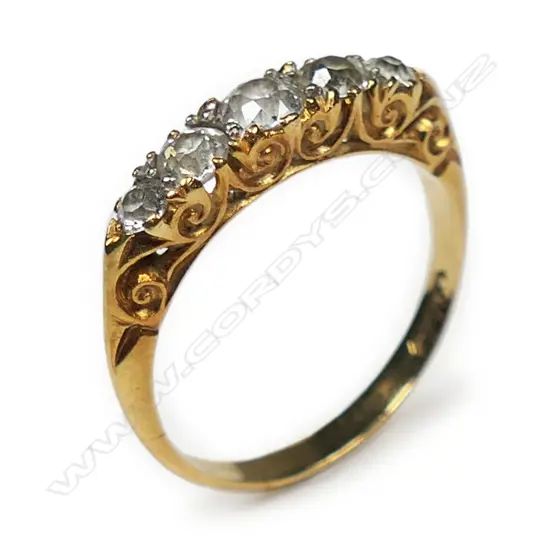 A c.1900 18ct yellow gold five stone diamond bridge ring,