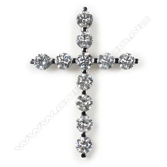 A 14ct white gold and diamond cross pendant,