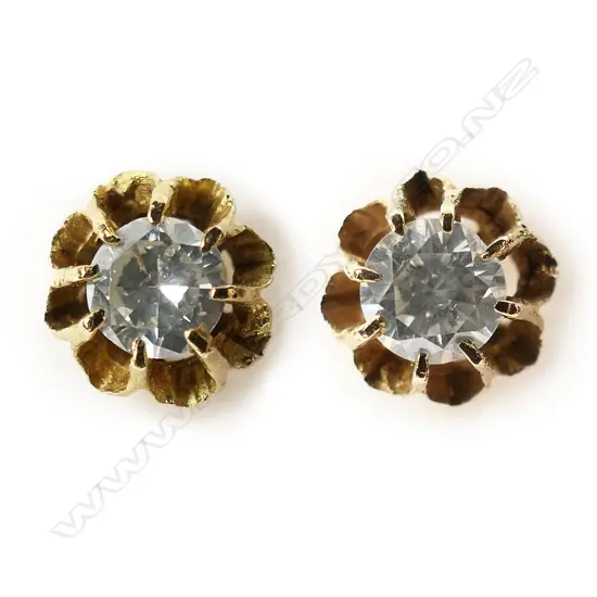 A pair of 9ct gold and diamond stud earrings,