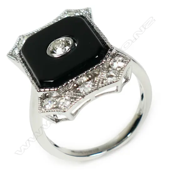 A 14ct white gold onyx and diamond Art Deco style ring,