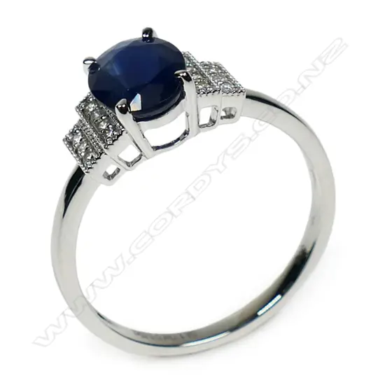 A 14ct white gold diamond and sapphire ring,