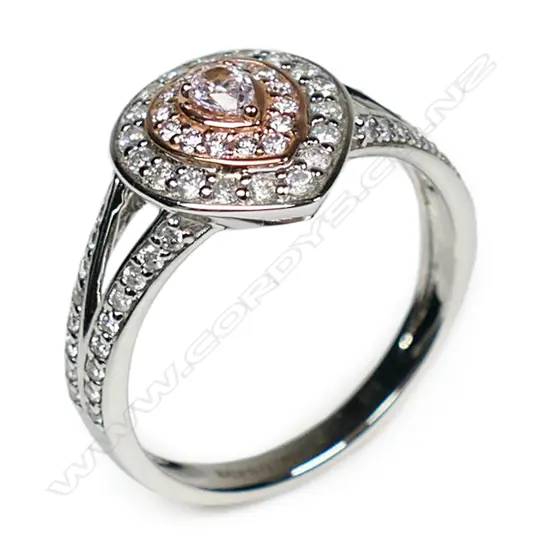 A 14ct white and rose gold pink diamond double halo ring,