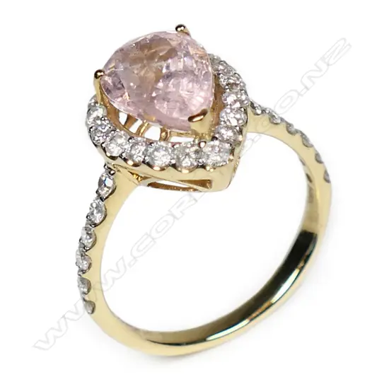 A 14ct gold morganite and diamond halo ring,