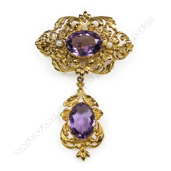 A Victorian style gilded 9ct gold and amethyst brooch,
