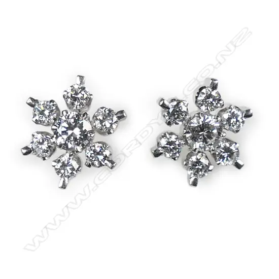 A pair of 18ct white gold and diamond cluster earrings,