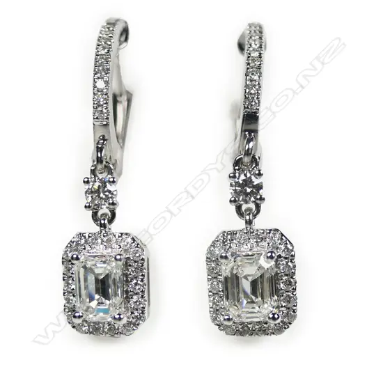 A pair of 18ct white gold and diamond earrings,