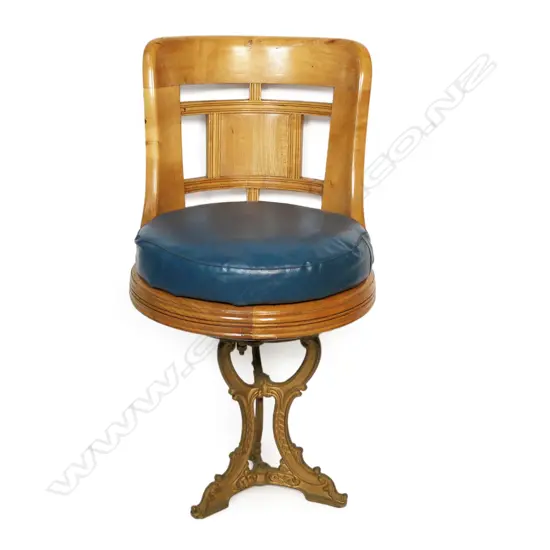 An early 20thC teak ship's saloon chair,