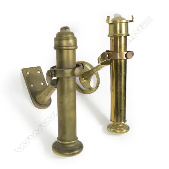 Two ship's brass gimbal wall mounted candlesticks,