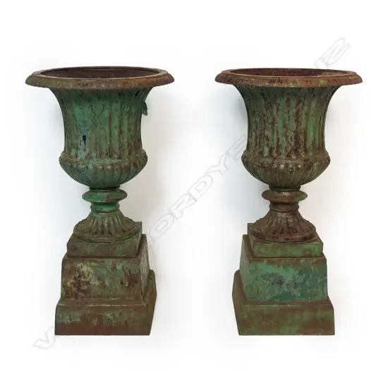 A pair of vintage cast iron garden urns,