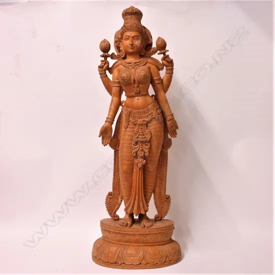 A carved Indian large wood figure of the voluptuous goddess