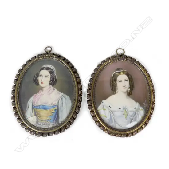A pair of hand painted portrait miniatures on ivory