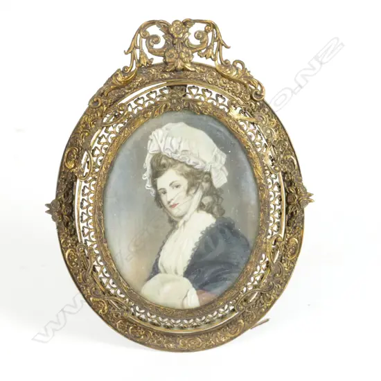 A hand painted portrait miniature on ivory