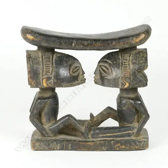 A carved Hemba tribal headrest