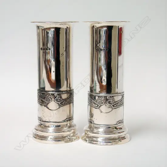 A pair of early 20thC Arts & Crafts silver vases