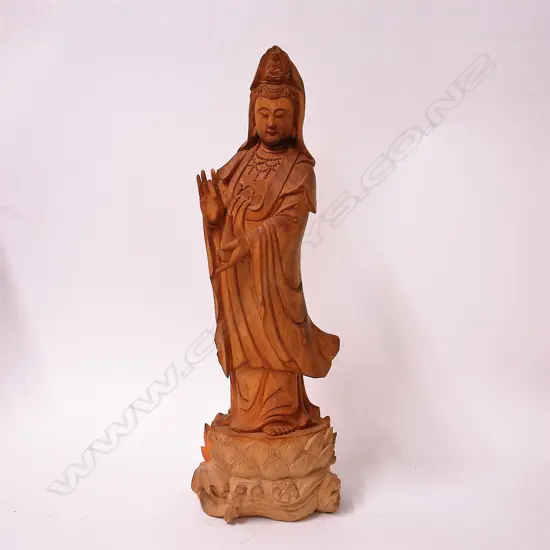 A carved wood Chinese figure of Kuanyin