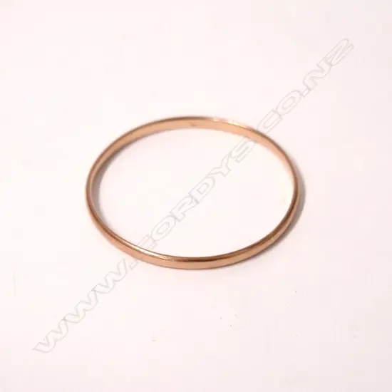 A 9ct. rose gold bangle