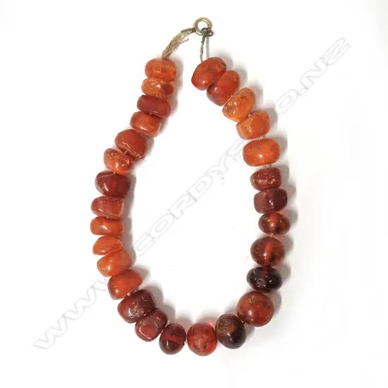 An antique nugget amber bead necklace