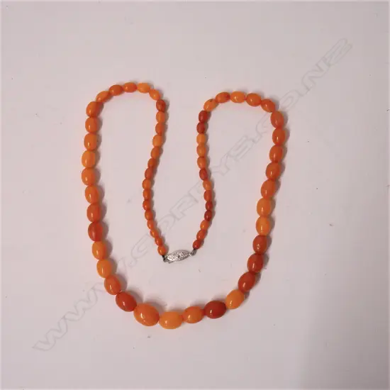 A vintage butterscotch amber tapered bead necklace